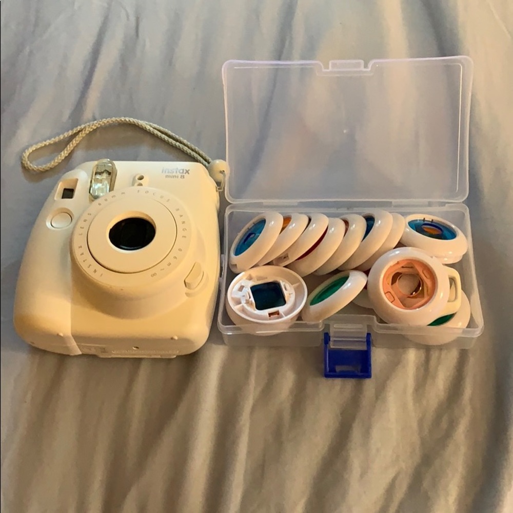 Fujifilm Polaroid camera and colorful lens caps